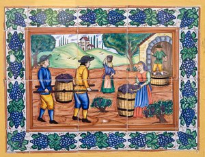 Piastrelle ceramiche spagnole moderne in stile del XVII o XVIII secolo che mostrano lavoratori che trasportano l